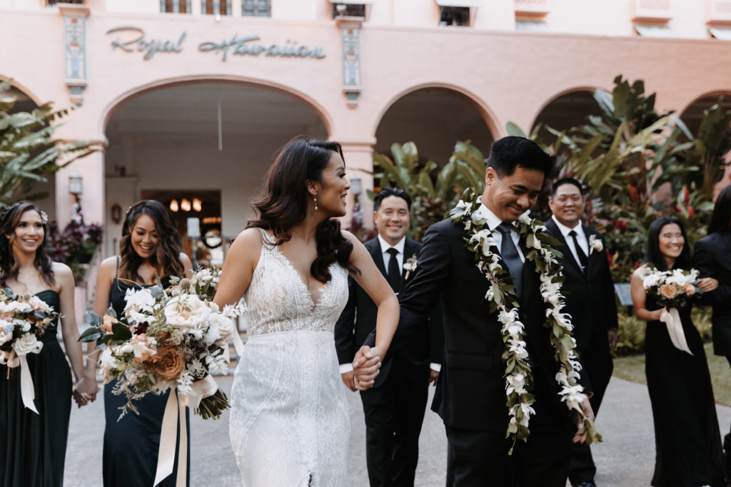 Wedding party photo in front of royal hawaiian hotel