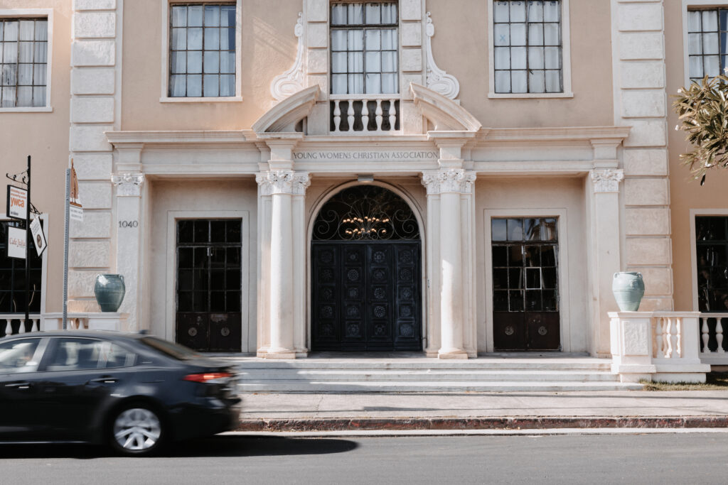 Wedding Photography - European style architecture building front with a car driving past
