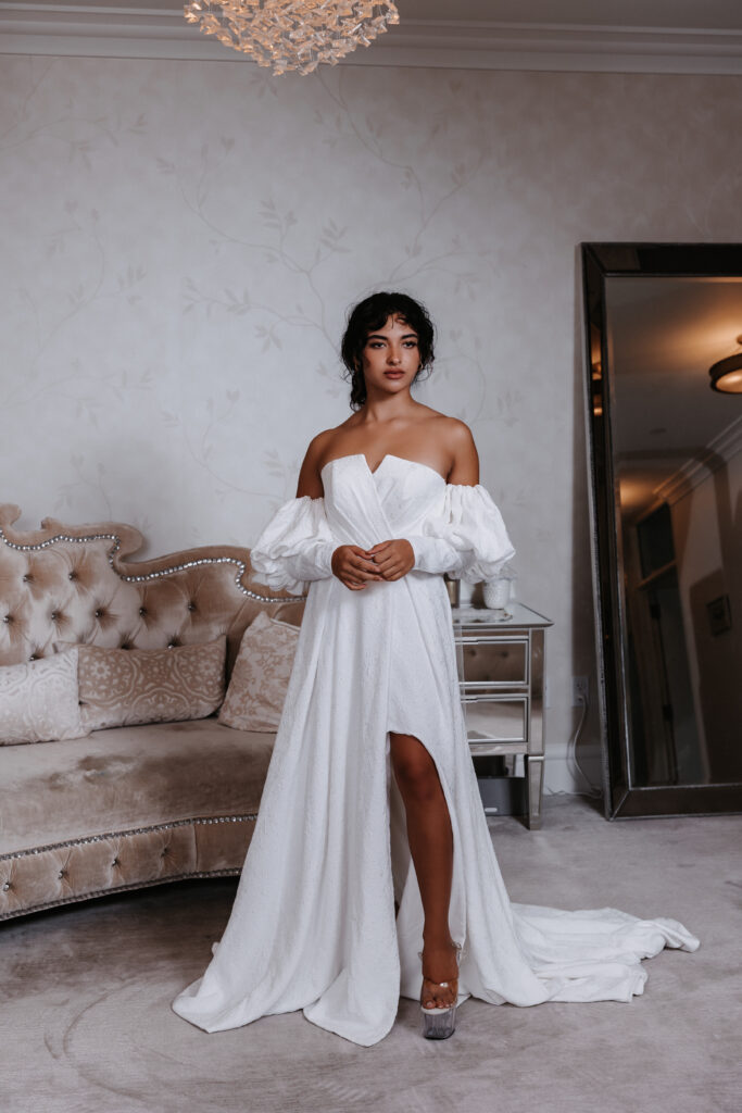 Bride posing in her wedding dress